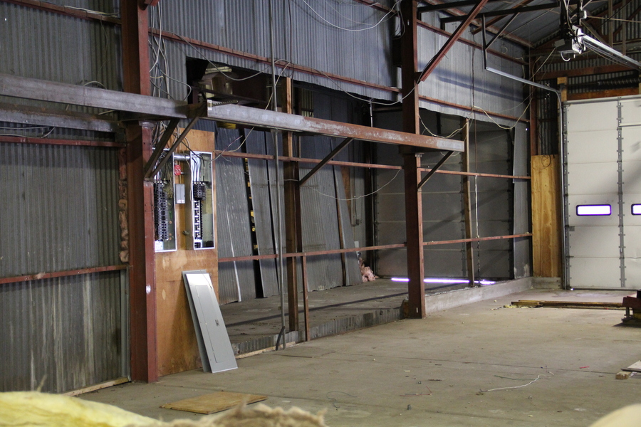 The metal wall between spaces has been removed.