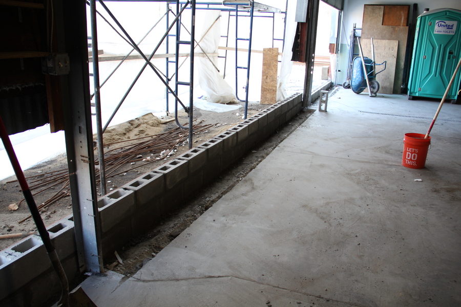 Front of the building that was garage doors will soon be a solid wall.