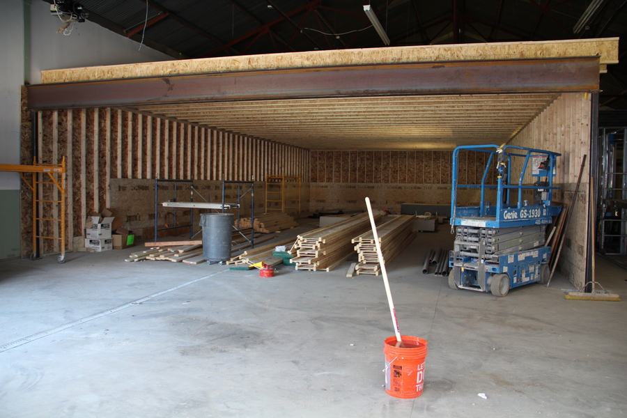 The range area with one the steel beams that will support the second floor.